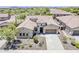Stunning single-story home showcasing a tile roof, neutral stucco, and a well-manicured desert landscape at 30374 N 124Th Dr, Peoria, AZ 85383