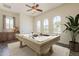 Recreation room with a pool table, a ceiling fan, and natural light from large windows at 30374 N 124Th Dr, Peoria, AZ 85383