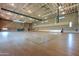 Spacious gymnasium featuring basketball courts and ample room for various recreational activities and community events at 30374 N 124Th Dr, Peoria, AZ 85383