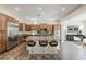 Well-appointed kitchen with a large island, stainless steel appliances, and plenty of cabinet space at 30374 N 124Th Dr, Peoria, AZ 85383