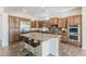 Gorgeous kitchen featuring granite countertops, stainless steel appliances, and custom cabinetry at 30374 N 124Th Dr, Peoria, AZ 85383