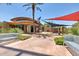 Outdoor gathering spot with fireplace and comfortable seating, perfect for socializing and enjoying the beautiful surroundings at 30374 N 124Th Dr, Peoria, AZ 85383