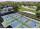 Aerial view of the community's many pickleball courts, nestled in lush greenery and offering ample space for friendly competition at 30374 N 124Th Dr, Peoria, AZ 85383