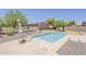 A sparkling private pool is nestled within a low-maintenance desert landscape and green putting green at 30374 N 124Th Dr, Peoria, AZ 85383