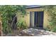 Back patio area with sliding glass door and yard with plants at 3404 W Tangerine Ln, Phoenix, AZ 85051