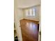 A bright bedroom with hardwood floors and a window at 3404 W Tangerine Ln, Phoenix, AZ 85051
