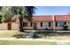 Charming exterior view of home, featuring a red tile roof and a cozy front yard with mature tree at 3404 W Tangerine Ln, Phoenix, AZ 85051