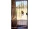 A view through a security door out onto the front lawn at 3404 W Tangerine Ln, Phoenix, AZ 85051