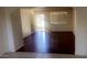 Bright living room with wood flooring, showcasing natural light and a view to outdoor space at 3404 W Tangerine Ln, Phoenix, AZ 85051