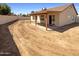 Spacious backyard with a covered patio area, perfect for outdoor entertaining at 3407 N 67Th Ln, Phoenix, AZ 85033