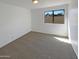 Bedroom with carpet and a window overlooking the backyard at 3407 N 67Th Ln, Phoenix, AZ 85033