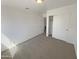 Bedroom with carpet, closet and entrance to another room at 3407 N 67Th Ln, Phoenix, AZ 85033