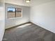 Bedroom with carpet and a window overlooking the backyard at 3407 N 67Th Ln, Phoenix, AZ 85033
