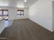 Spacious living room featuring neutral carpet and a large window for natural light at 3407 N 67Th Ln, Phoenix, AZ 85033