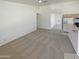 Open living space combining carpet and tile, adjacent to the kitchen and dining area at 3407 N 67Th Ln, Phoenix, AZ 85033