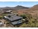 Desert estate showcasing a modern design, lush landscaping, and backyard pool with solar panels at 36133 N 24Th Ave, Phoenix, AZ 85086