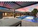 Beautiful backyard with sparkling pool, covered patio, lounge seating and views of dusk sky at 36133 N 24Th Ave, Phoenix, AZ 85086