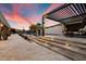 Step into a backyard oasis with a pergola, steps leading to the pool, and desert views at 36133 N 24Th Ave, Phoenix, AZ 85086