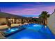 Stunning backyard at twilight, featuring a large pool, spa, and outdoor entertaining space at 36133 N 24Th Ave, Phoenix, AZ 85086