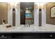 Bathroom vanity with marble countertop, decorative mirrors, and modern lighting fixtures for a stylish design at 36133 N 24Th Ave, Phoenix, AZ 85086