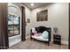 Cozy bedroom with large window, plush carpet and a crib filled with stuffed animals at 36133 N 24Th Ave, Phoenix, AZ 85086