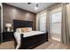Bedroom with dark wood furniture, plush carpet, and large windows offering plenty of natural light at 36133 N 24Th Ave, Phoenix, AZ 85086