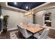 Elegant dining room with a contemporary light fixture and ample seating for gatherings at 36133 N 24Th Ave, Phoenix, AZ 85086