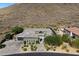 Stunning desert home with beautiful stonework, mature landscaping, and a charming paver driveway at 36133 N 24Th Ave, Phoenix, AZ 85086