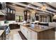 Spacious kitchen boasts a large island, beamed ceilings, and an abundance of natural light at 36133 N 24Th Ave, Phoenix, AZ 85086