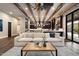 Comfortable living space with high ceilings, exposed beams, and open kitchen concept at 36133 N 24Th Ave, Phoenix, AZ 85086