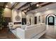Spacious living room with exposed beams, stone fireplace, and hardwood flooring at 36133 N 24Th Ave, Phoenix, AZ 85086