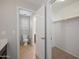 Bright bathroom featuring a toilet with a shuttered window and an attached walk-in closet at 3822 E Amber Ln, Gilbert, AZ 85296