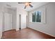 Bedroom with hard wood flooring, and large window with shade coverings at 3822 E Amber Ln, Gilbert, AZ 85296