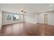 Primary bedroom with hard wood flooring, and a large window at 3822 E Amber Ln, Gilbert, AZ 85296