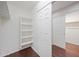 Walk-in closet with custom shelving and sliding doors for storage at 3822 E Amber Ln, Gilbert, AZ 85296