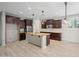 Spacious kitchen with dark cabinetry, granite counters, stainless appliances, and subway tile backsplash at 3822 E Amber Ln, Gilbert, AZ 85296
