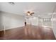 Open living room with hard wood flooring, stairs, and an open floor plan at 3822 E Amber Ln, Gilbert, AZ 85296