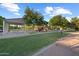 Community playground featuring covered picnic area, play equipment and mature shade trees at 3822 E Amber Ln, Gilbert, AZ 85296