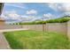 A backyard with a mix of grass and gravel, offering great space for activities at 3938 E Appaloosa Rd, Gilbert, AZ 85296