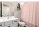 Cozy bathroom featuring a vanity and a soft pink shower curtain at 3938 E Appaloosa Rd, Gilbert, AZ 85296