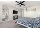 Well-lit bedroom with a view of the bathroom and a mounted TV for optimal viewing at 3938 E Appaloosa Rd, Gilbert, AZ 85296