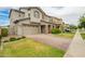 Charming two-story home with a well-manicured lawn, stone accents, and a two-car garage at 3938 E Appaloosa Rd, Gilbert, AZ 85296