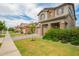 Charming two-story home with a well-manicured lawn, stone accents, and a two-car garage at 3938 E Appaloosa Rd, Gilbert, AZ 85296