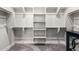 A walk-in closet with custom shelving and hanging space for ample storage solutions at 3938 E Appaloosa Rd, Gilbert, AZ 85296