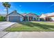 Charming single-story home boasts desert landscaping, a spacious front yard, and a two-car garage at 4050 E Encinas Ave, Gilbert, AZ 85234