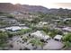 Desert home featuring palm trees, xeriscaping, and mountain views at 4836 E Moonlight Way, Paradise Valley, AZ 85253