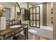 Bathroom featuring vanity with bronze hardware, and tiled shower at 4836 E Moonlight Way, Paradise Valley, AZ 85253