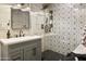 Updated bathroom with sleek vanity, walk-in shower with decorative tile, and modern fixtures at 4836 E Moonlight Way, Paradise Valley, AZ 85253