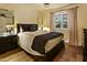 Bedroom with neutral colors, lamps, and window views at 4836 E Moonlight Way, Paradise Valley, AZ 85253