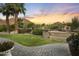 Beautiful property featuring palm trees, a brick walkway and lush, mature landscaping with mountain views at 4836 E Moonlight Way, Paradise Valley, AZ 85253